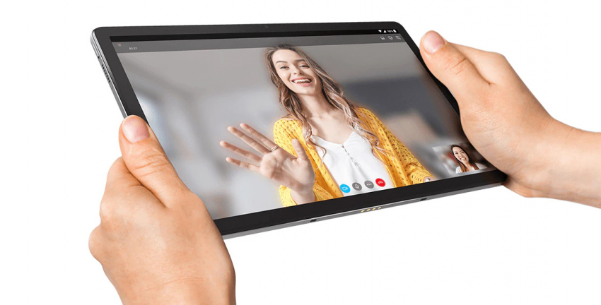 Two hands holding Lenovo Tab P11 Plus tablet with two video call participants on the display